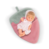 ASI Dolls - Lalka Bonboncin Strawberry Doll lying on a pink and green textured blanket, wearing a pink outfit.