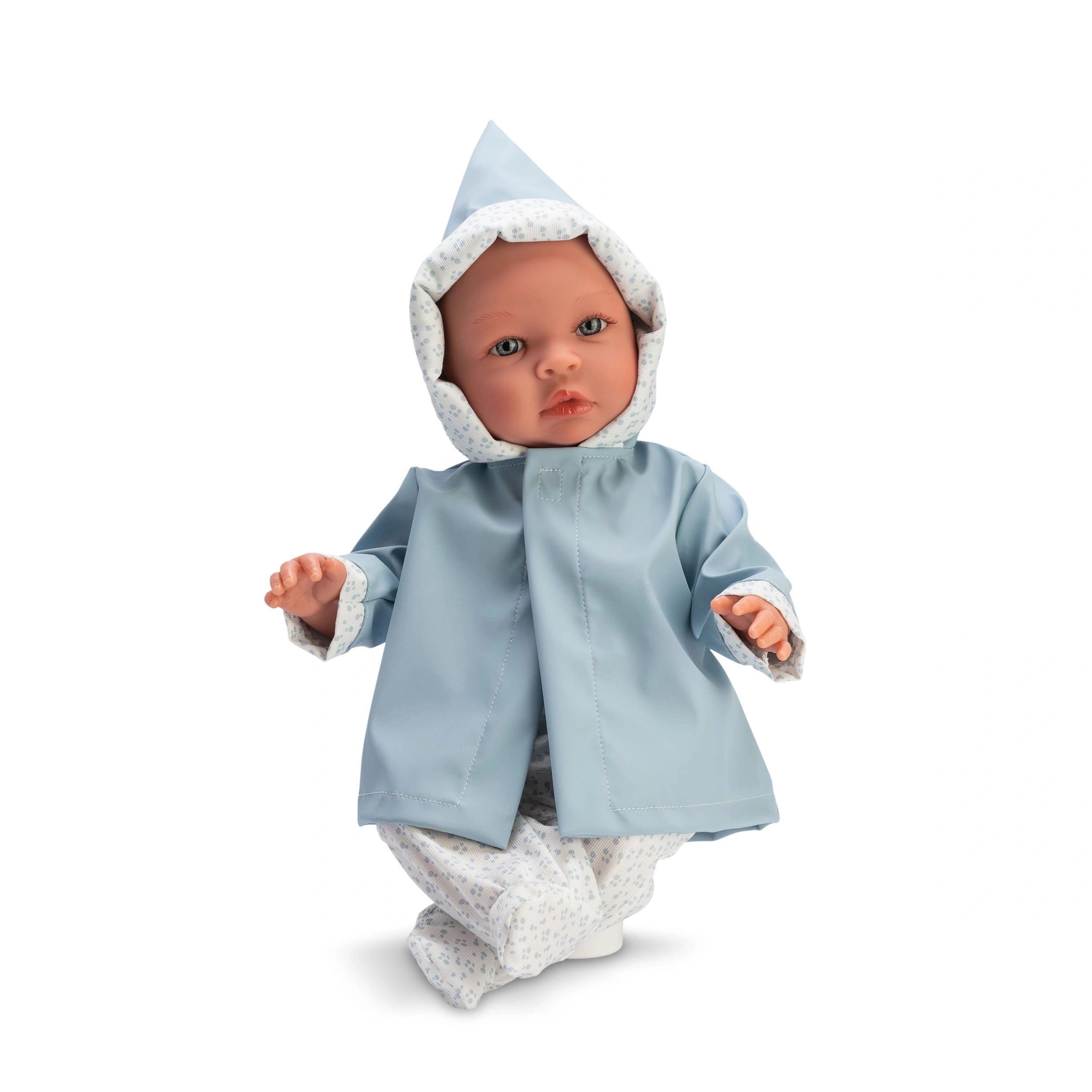 Leo doll in a blue raincoat with a hood, large expressive eyes, soft body, and vinyl limbs, sitting upright.