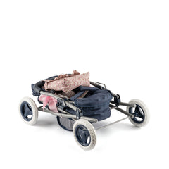 Folded navy blue Cloe Baby Stroller with white wheels, pink floral fabric, and pink ribbon detail.