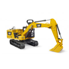 Yellow Bruder CAT Excavator toy with movable arm and shovel, on black tracks, set against a plain background.