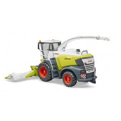 Bruder Claas Jaguar 980 toy chopper with a green and white body, red wheels, and detachable corn header.
