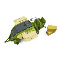 Bruder Krone Big Pack 1290HDP toy baler in green and beige with two yellow block hay bales.