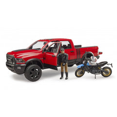 Red Bruder RAM 2500 Power Wagon toy with open doors, biker figure, and Ducati Desert Sled motorcycle.