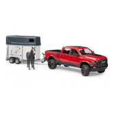 Red Bruder RAM 2500 Power Wagon toy with horse trailer and black horse.