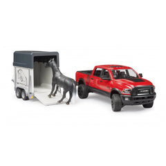 Red Bruder RAM 2500 toy truck with a horse trailer. A black horse is positioned on the trailer ramp.