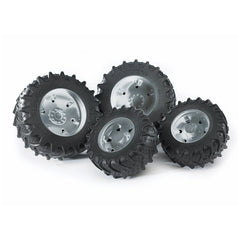 Twin black rubber tyres with silver hubs, designed for Bruder 3000 Series play vehicles, showing robust tread pattern.