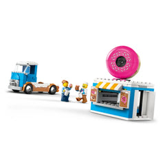 LEGO City Donut Truck set featuring a blue truck, colorful donut stand with pink donut on top, and three minifigures enjoying donuts.