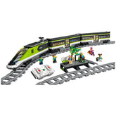 LEGO City Express Passenger Train set with a sleek green and gray locomotive, two minifigures, remote controls, and a waiting area with a tree.