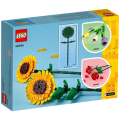 LEGO Creator Sunflowers construction set box featuring two vibrant yellow sunflower blooms with brown centers, green stems, and leaves against a light blue background. The box includes visual highlights of additional flower sets.