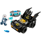 LEGO Batman sits in a black Batmobile with yellow accents, while Mr. Freeze stands nearby, holding an ice beam.