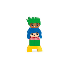 Two colorful LEGO® DUPLO® characters stacked on a yellow base. The top character has green hair and a happy expression, while the bottom character wears a blue shirt with a plaid design and has a cheerful smile.