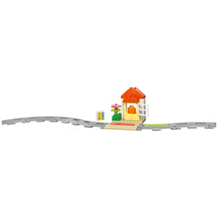 Colorful LEGO® DUPLO® Interactive Adventure Train set featuring a small house with an orange roof, a flower, and short curved track.