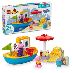 Colorful LEGO® DUPLO® Peppa Pig Boat Trip set featuring two figures, Peppa Pig and Grandpa Pig, with a buildable boat, beach umbrella, sandcastle, and accessories for imaginative play.