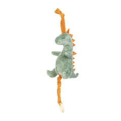 Green plush dinosaur carillon with orange spikes and pull string, designed for babies.