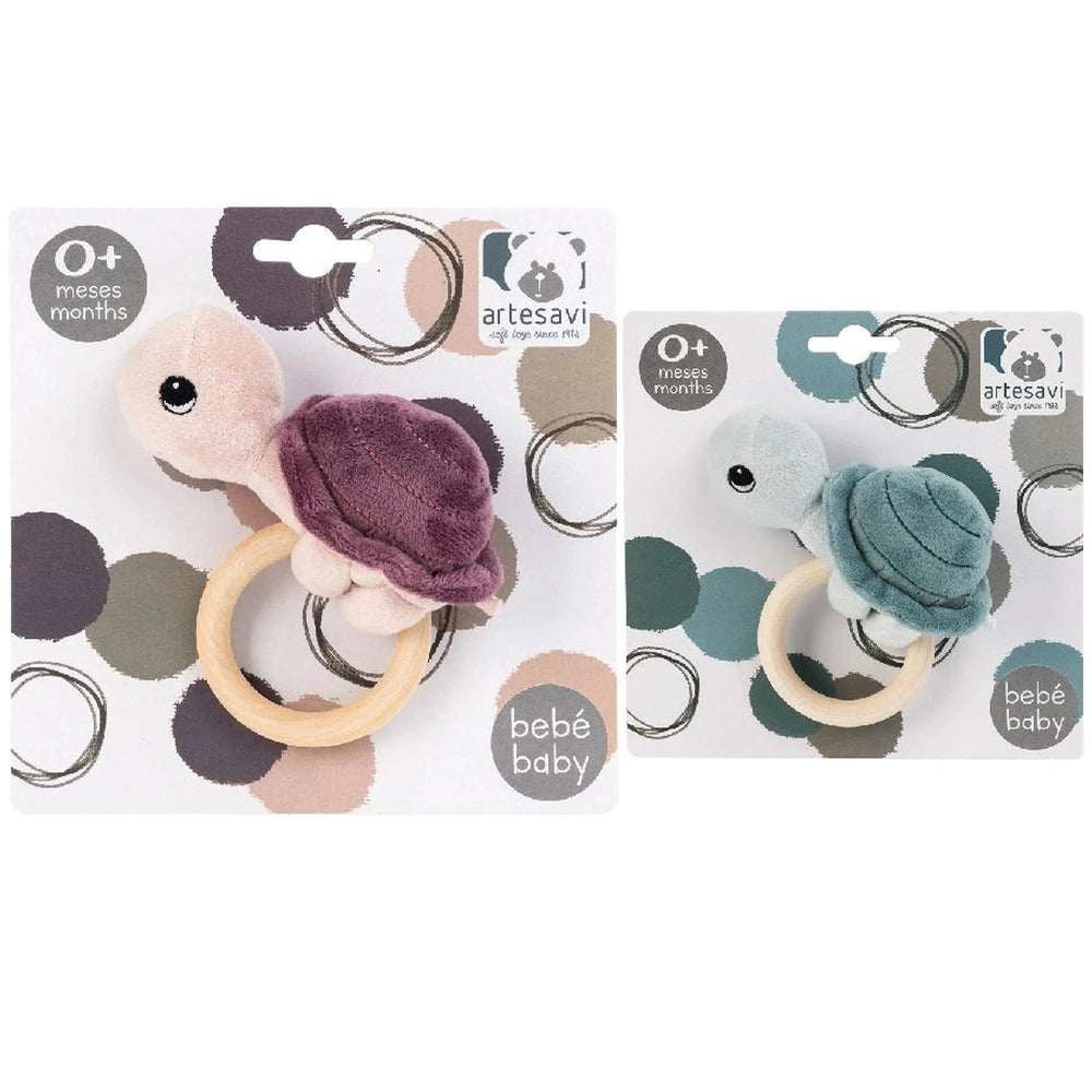 ARTESAVI Turtle Plush Rattle in purple and blue, with wooden ring handle, designed for infants 0+ months.