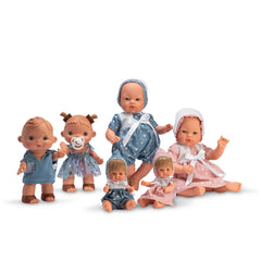 Six dolls from the ASI Dolls Koke Ranita collection, dressed in blue and pink outfits, sitting and standing.