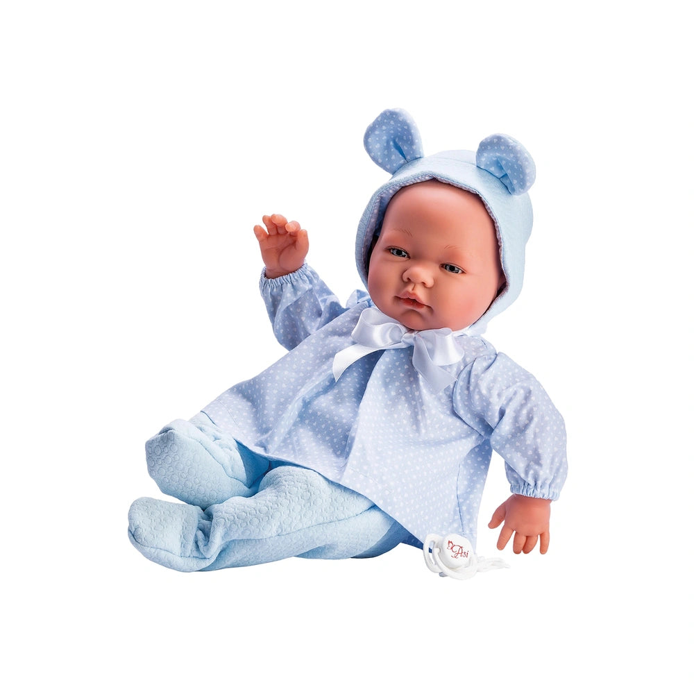 Pablo doll in blue hearts dress, wearing hat with ears, posed on a white background.
