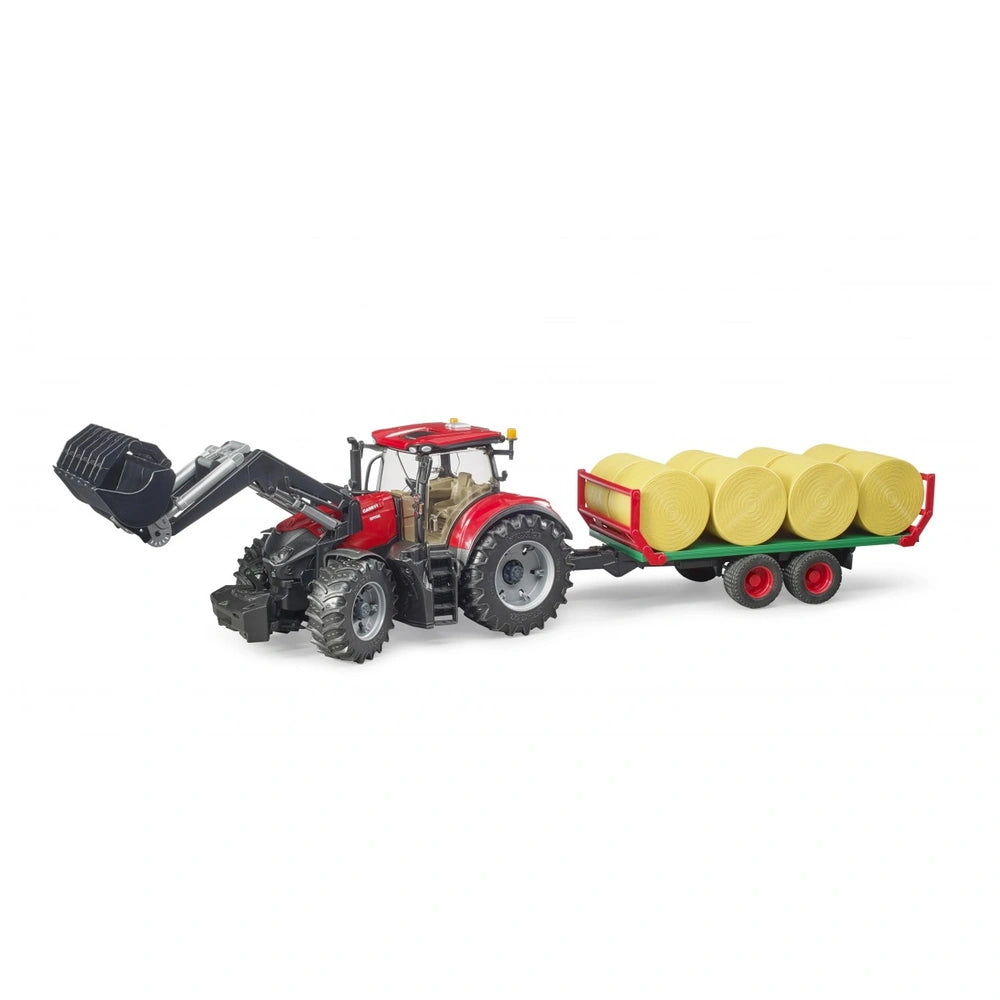 Red Bruder Case IH Optum 300CVX tractor with bale transport trailer carrying yellow round bales on white background.
