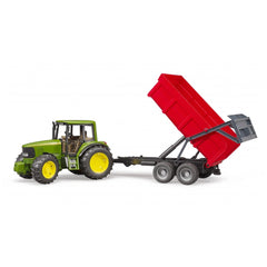 Green John Deere 6920 toy tractor with a red tipping trailer, showcasing realistic design.