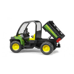 Bruder John Deere Gator XUV 855D toy in green and black, side view, with open cabin and tilting cargo bed.