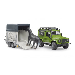Green Land Rover Defender toy with horse trailer and gray horse entering.
