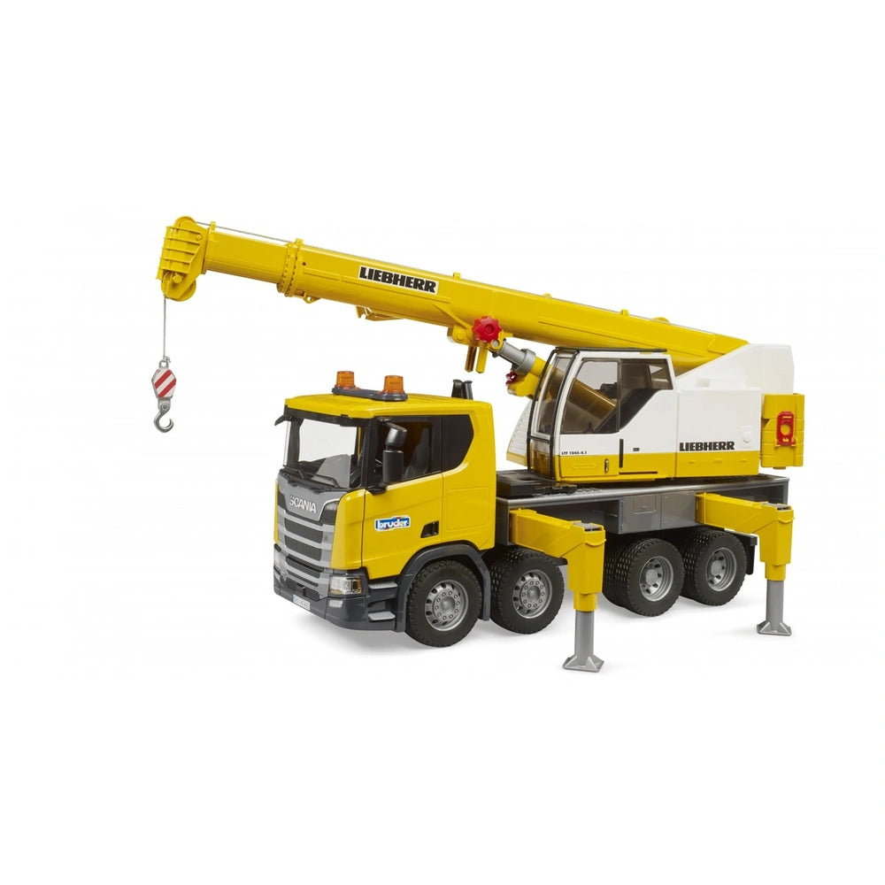 Yellow Bruder Scania crane truck toy with extendable Liebherr crane arm and stabilizers, detailed cab design.