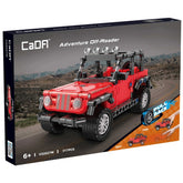 CaDA Adventure Off-Roader Jeep construction set in red with black accents, featuring wheels, headlights, and a desert backgro