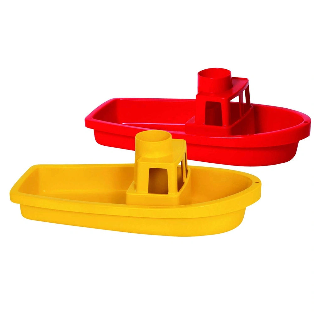 Gowi Cuxhaven beach toys featuring a red and yellow toy boat arranged centrally against a plain background.