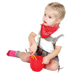 Gowi Cooking Set Vienna features a toddler in a white shirt and red bandana, holding a red bucket with yellow handles.