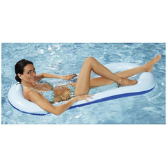 Happy People air mattress in rainbow colors, with a tanned woman in a bikini relaxing on it in clear blue water.