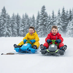 KHW Snow Fox sled in blue and black with green handle, children in red and yellow snowsuits play in the snow.