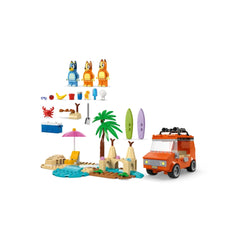 Colorful LEGO set featuring Bluey, Bingo, and Chilli figures, an orange family car with surfboards, palm trees, and beach accessories.