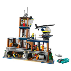 LEGO City Police Prison Island construction set featuring a detailed prison, helicopter, and multiple minifigures, including inmates and officers.