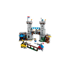 Medieval-style LEGO castle with two tall towers, featuring a drawbridge, knights on horseback, and various playset accessories.