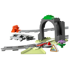 LEGO® DUPLO® Train Tunnel and Tracks Expansion Set featuring a gray tunnel, curved tracks, and colorful accessories like a traffic sign and a flower element.