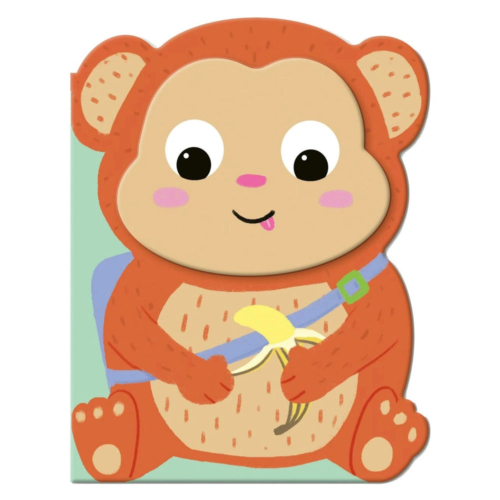 MACRO JUNIOR book featuring a monkey with a gradient fur, holding a yellow banana on matte cardboard surface.