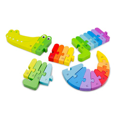 Yellow crocodile-shaped alphabet puzzle with interlocking red, blue, green, and orange pieces arranged in a circle.