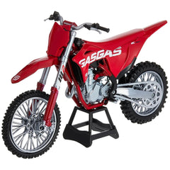 Gasgas Mc 450F dirt bike die cast model in red and silver with black wheels, showcasing detailed branding and components.