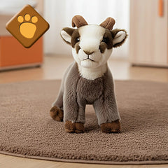 Rudy Little Mountain Chamois plush toy in gray and brown on a beige looped carpet, featuring horns and a white belly.