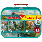 Schmidt Spiele Dinos puzzle box features colorful dinosaur designs, 100 white puzzle pieces, and a glossy green cardboard cas