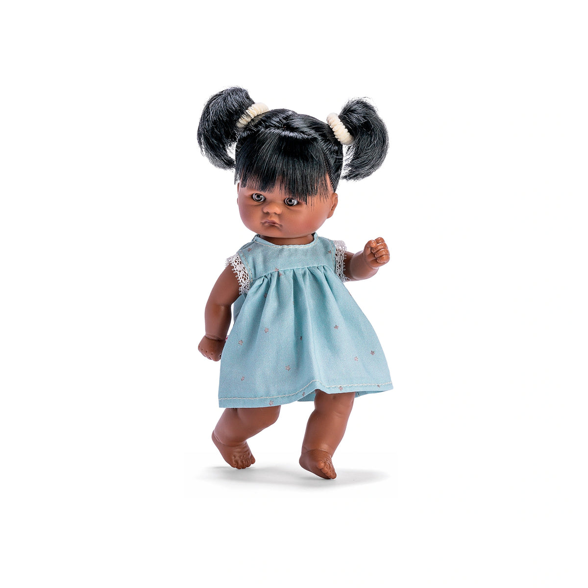 Cute ASI Dolls' Tom wearing a star-patterned blue dress, featuring black hair in pigtails, standing on one foot.