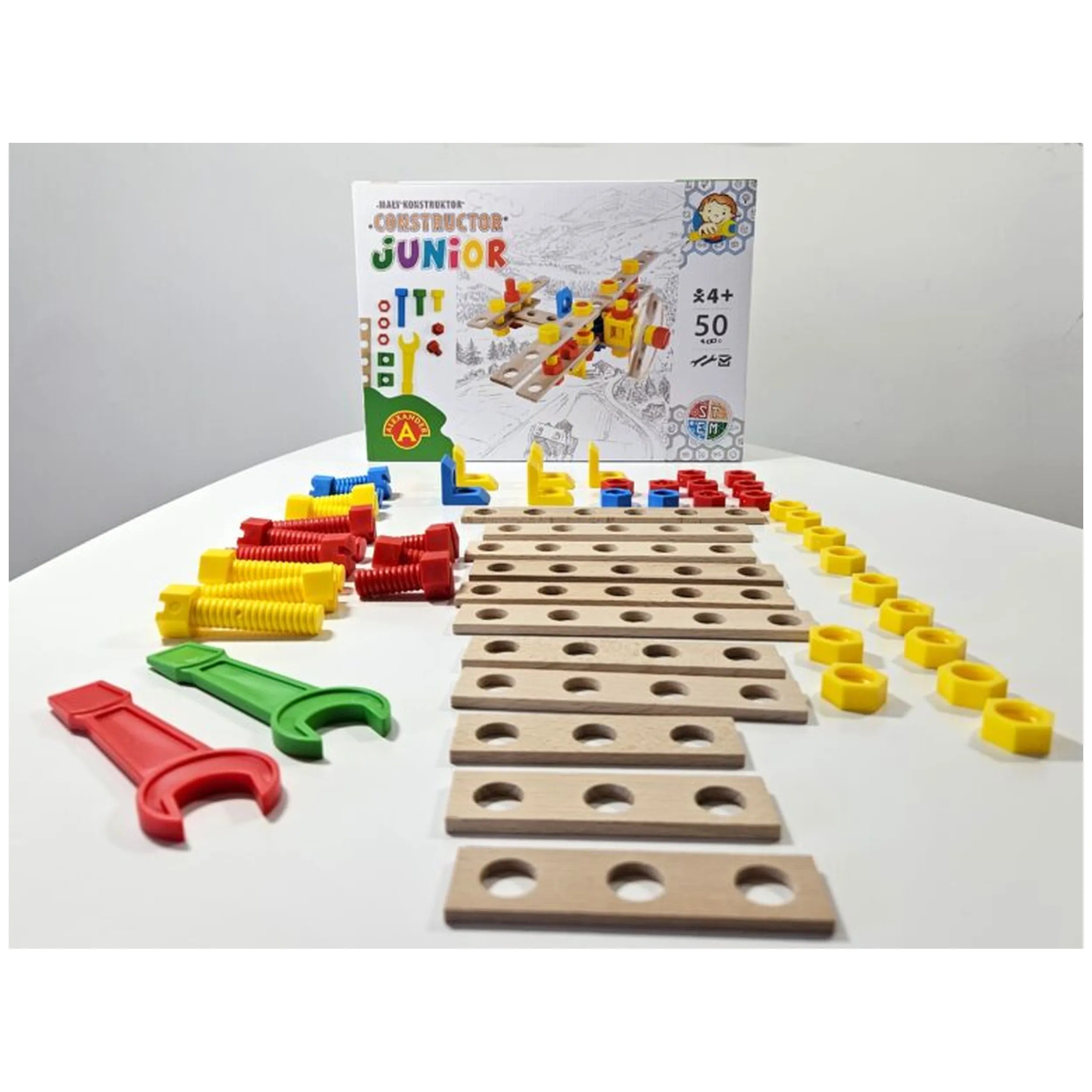 Constructor Junior Wooden Airplane Set with colorful screws, connectors, and 50 wooden pieces arranged on a table.