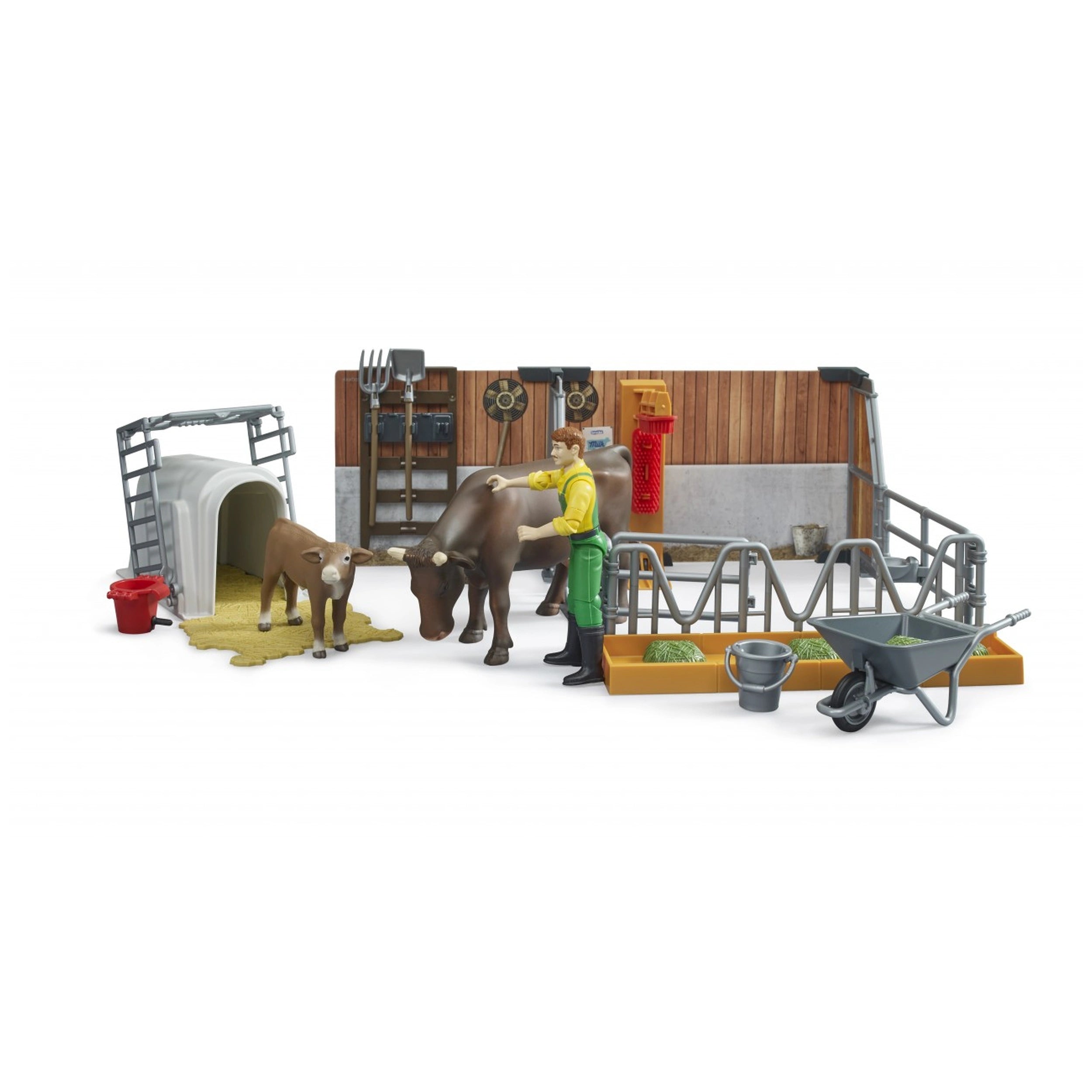 Farmer with cow and calf in a detailed barn playset, includes wheelbarrow, feed trough, and farm accessories.