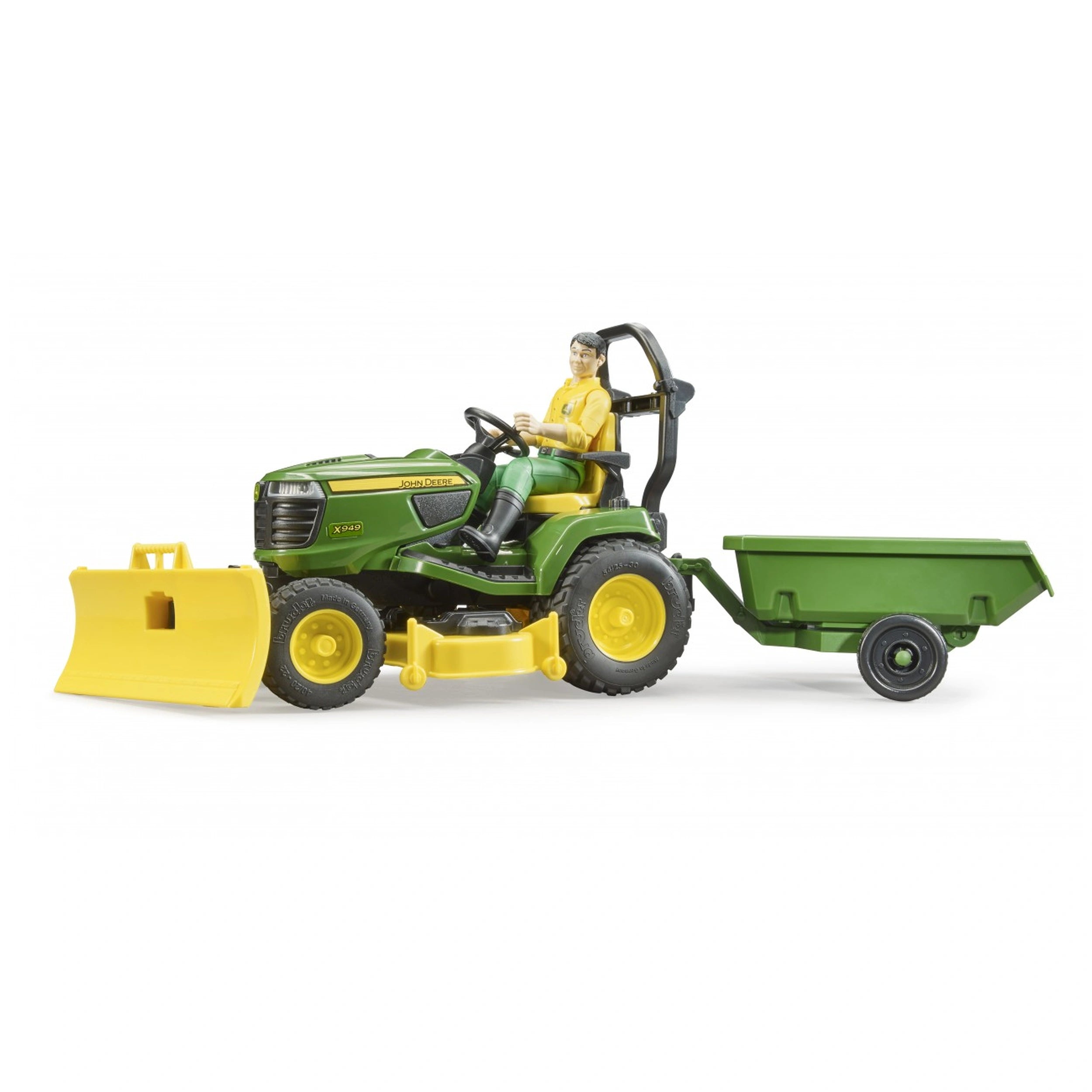 John Deere lawn tractor toy with snow plough, driven by a figure, attached green trailer.