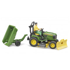 Toy John Deere lawn tractor with snow plough and trailer, featuring a figure in a yellow shirt.