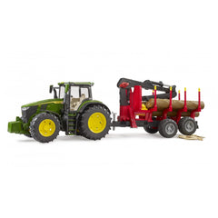 Green John Deere 7R 350 toy tractor with yellow wheels, pulling a red forestry trailer carrying four logs.