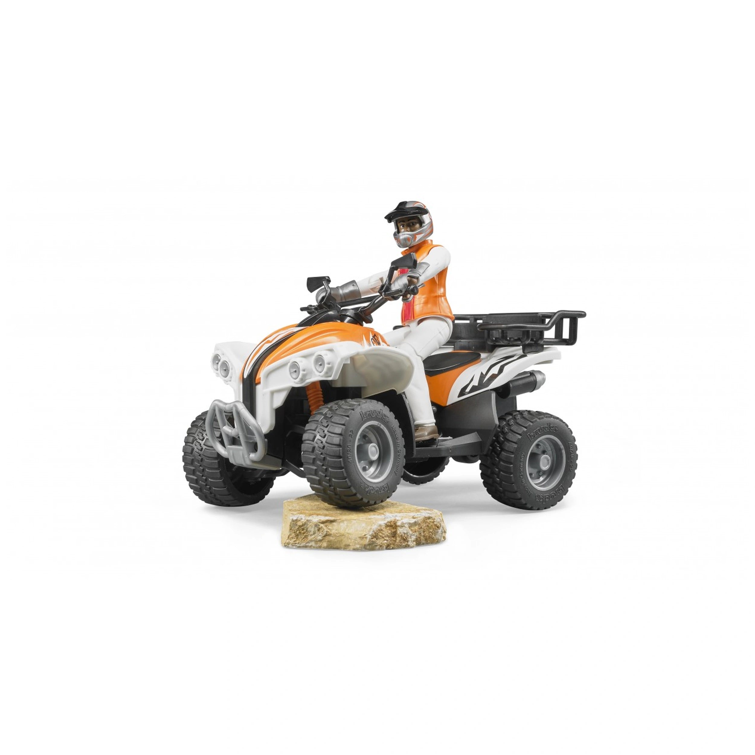 Orange and white quad toy with driver in helmet on rocky terrain, highlighting Bruder's durable design.