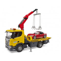 Yellow Bruder Scania Super 560R tow truck lifting a red roadster with its crane.
