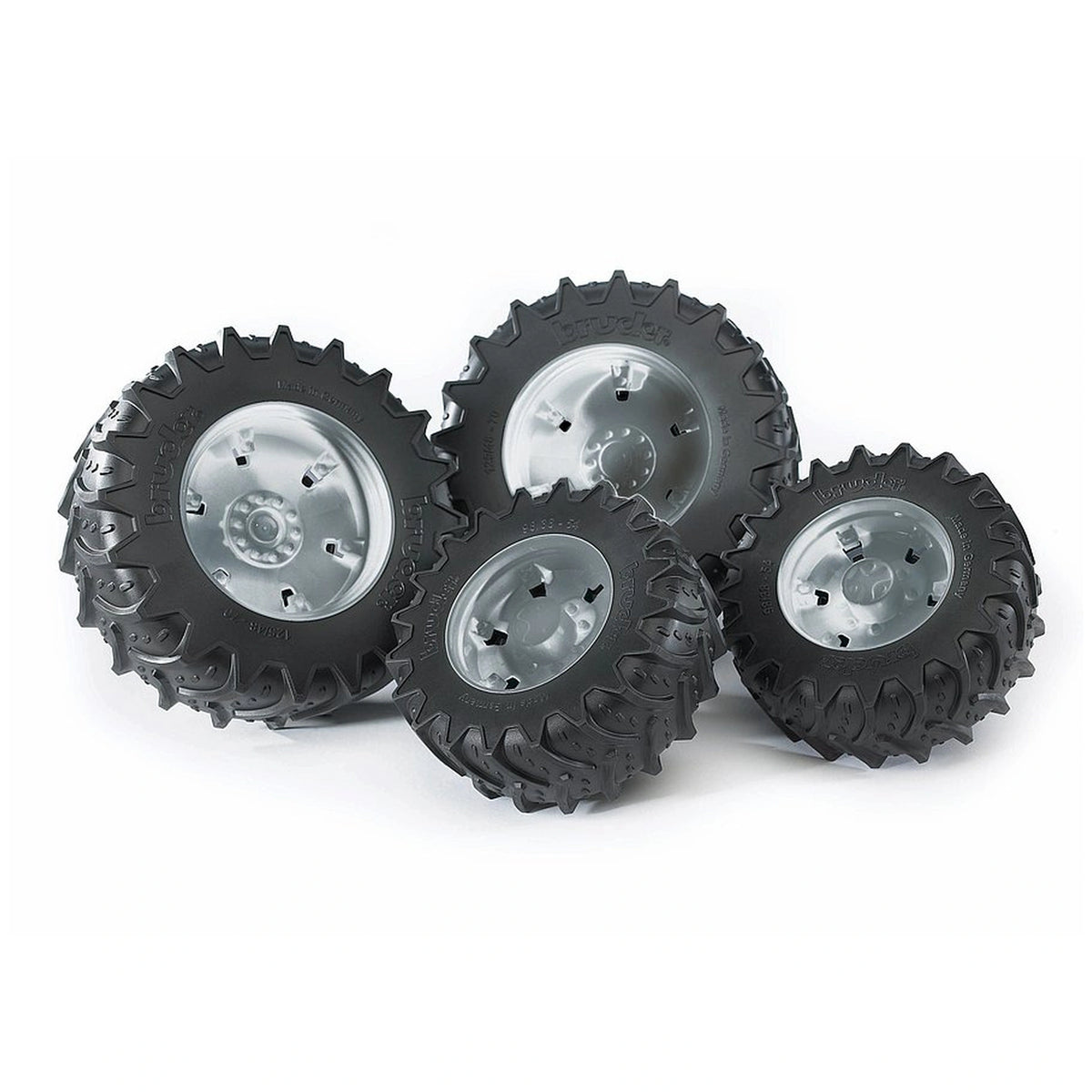 Twin black rubber tyres with silver hubs, designed for Bruder 3000 Series play vehicles, showing robust tread pattern.