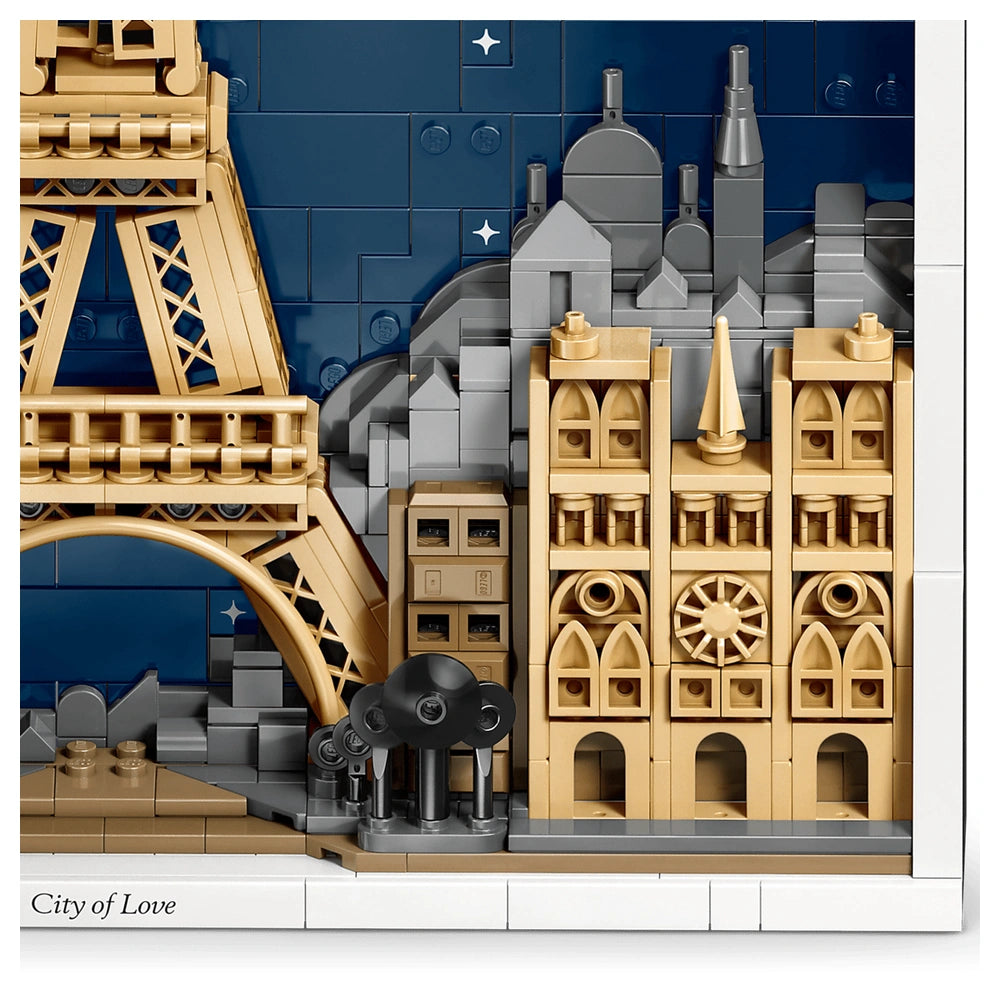 LEGO Architecture Paris set showcases a detailed cityscape with the Eiffel Tower and a bridge against a blue sky background.